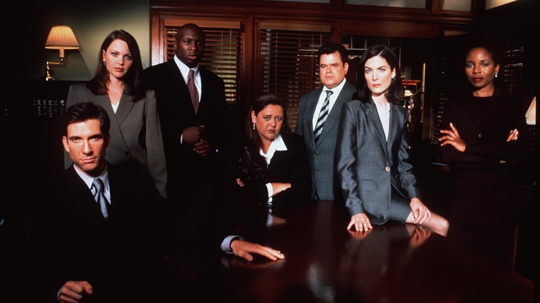 The main cast of the Practice sitting together in a room