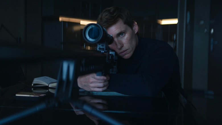 Alex Duggan (Eddie Redmayne) looking through a gun scope on The Day of the Jackal