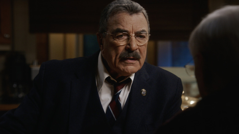 Frank Reagan (Tom Selleck) in a dark office on Blue Bloods