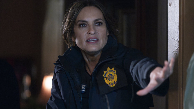 Olivia Benson (Mariska Hargitay) with arm reaching out in Law & Order: SVU