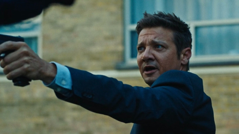 Mike McLusky (Jeremy Renner) pointing a gun at someone on Mayor of Kingstown