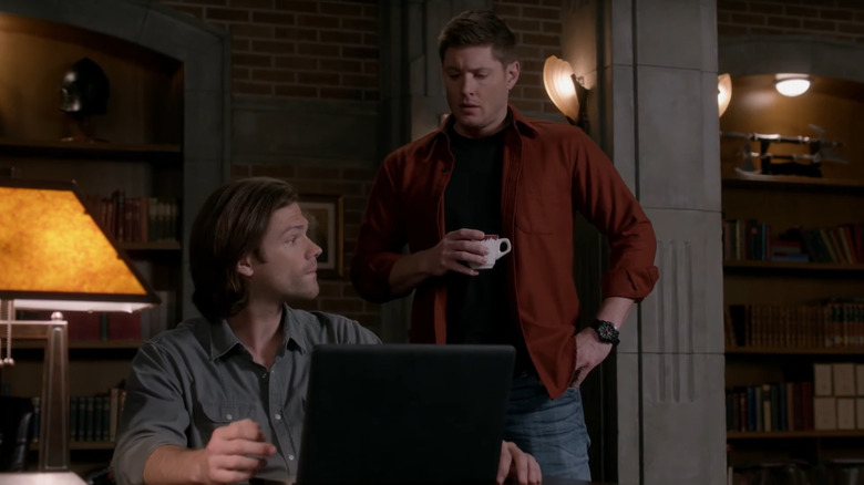 Jensen Ackles' Dean Winchester looking at Jared Padalecki's Sam Winchester in Supernatural