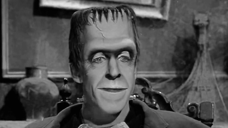 Fred Gwynne's Herman Munster smiling in The Munsters