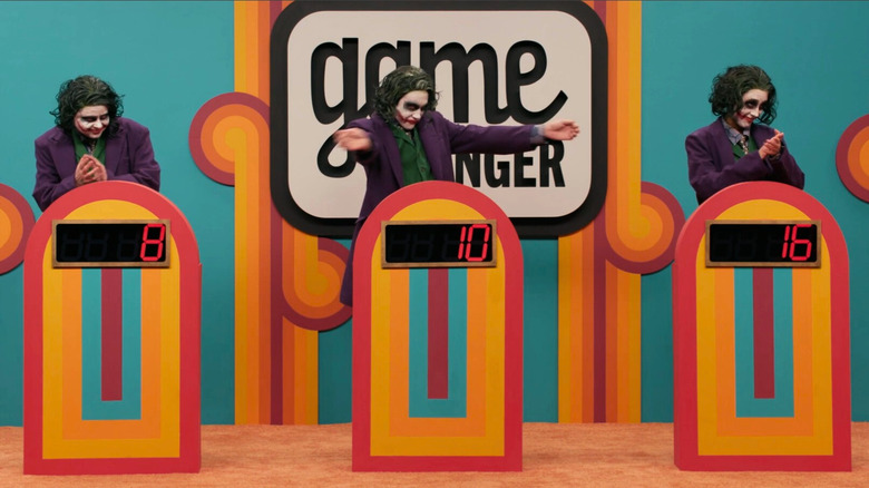 Ally, Zac, and Lisa dressed as three Jokers at their podiums on Game Changer