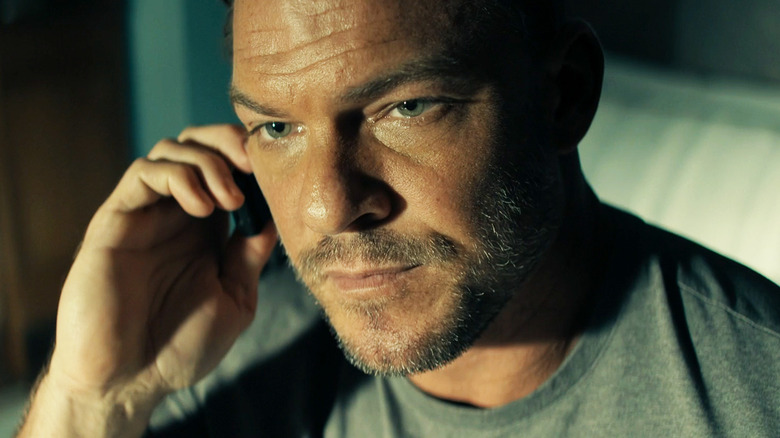 Alan Ritchson as Jack Reacher is seen in closeup in Reacher
