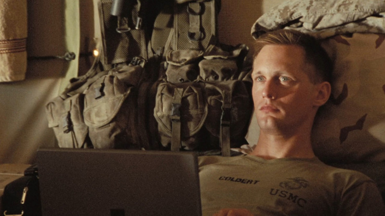 Goldert (Alexander Skarsgard) lying on cot with computer in Generation Kill