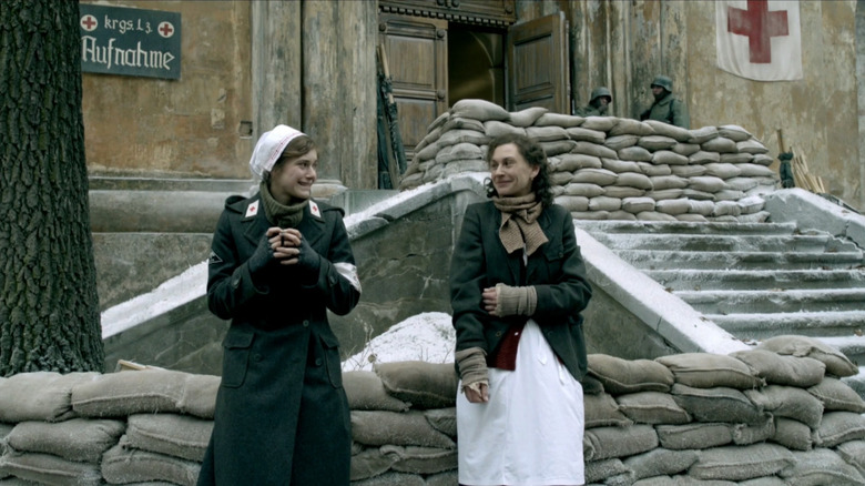 Charlotte (Miriam Stein) and Lilija (Christianne Paul) staring outside hospital in Generation War