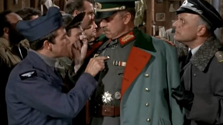Peter Newkirk (Richard Dawson) and the Inspector General (John Dehner) inspecting one another on Hogan's Heroes