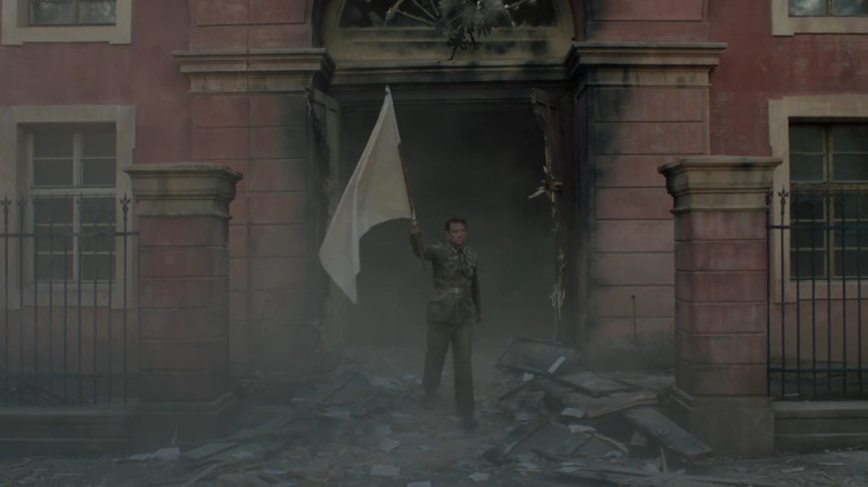 Soldier emerging from bombed building with white flag on World on Fire