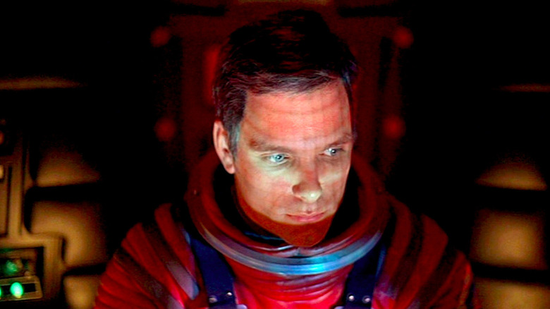 David Bowman (Keir Dullea) stares down at a console in 2001: A Space Odyssey