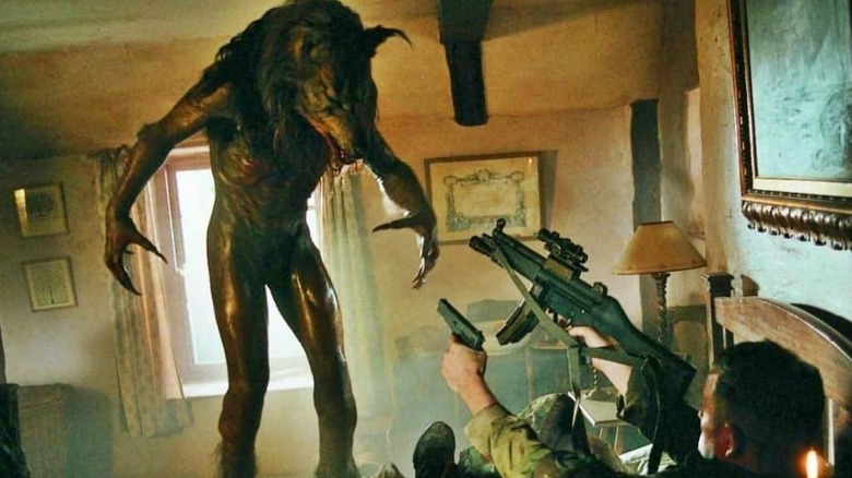 A soldier, fighting off a werewolf in Dog Soldiers
