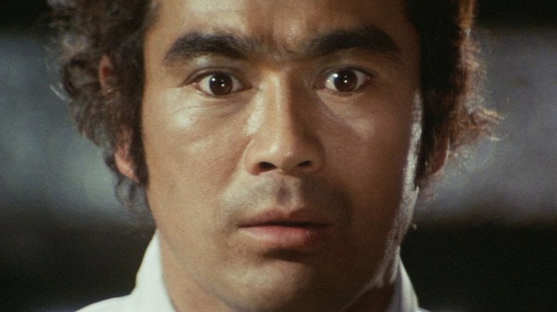 Sonny Chiba as Akira, shocked in Wolf Guy