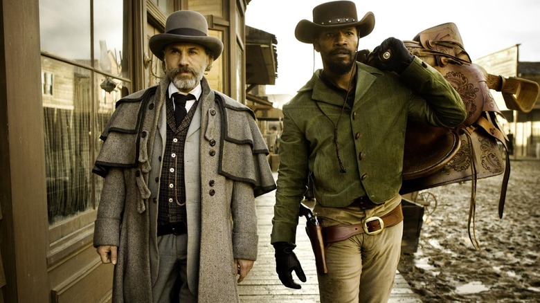 Christoph Waltz as Schultz and Jamie Foxx as Django, heading into town in Django Unchained