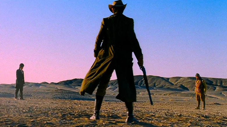 Lee Byung-hun as the bad, Jung Woo-sung as the good, and Song Kang-ho as the weird, facing off in The Good the Bad the Weird