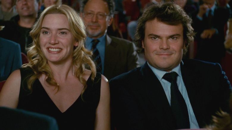 Kate Winslet and Jack Black as Iris and Miles sitting in a theater together in The Holiday