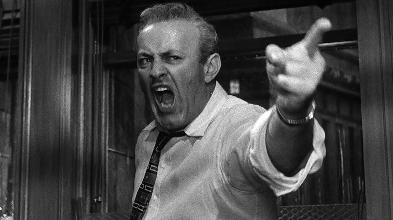 Lee J. Cobb playing Juror #3 in 12 Angry Men, angrily pointing his finger past the camera.