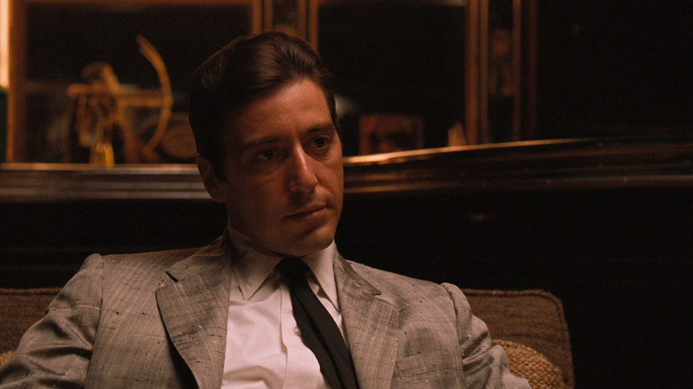 Al Pacino as Michael Corleone in The Godfather Part II, sitting down and wearing a suit.