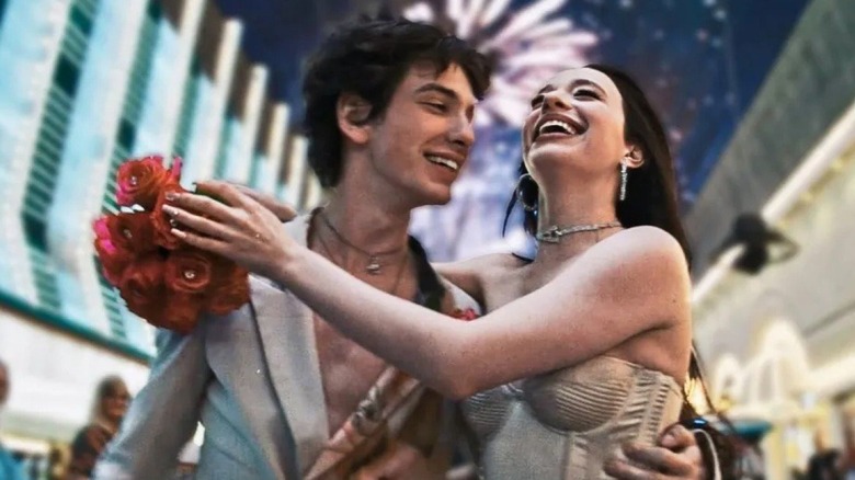 Mikey Madison as Anora Mikheeva and Mark Eydelshteyn as Ivan Zakharov, waking together and laughing in Anora.