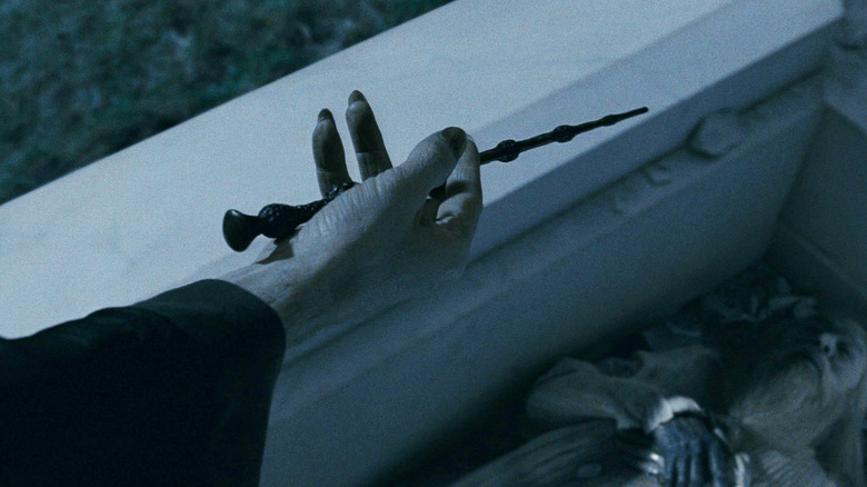 Voldemort's hand holding the Elder Wand in Harry Potter and the Deathly Hallows Part I
