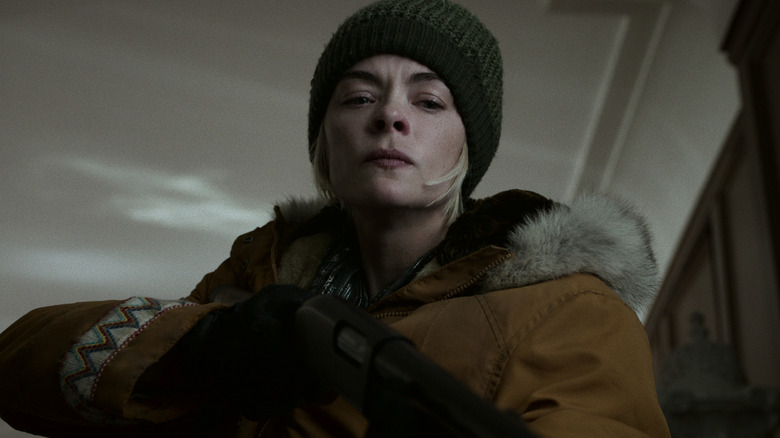 Rose (Jaime King) holding a gun on Black Summer