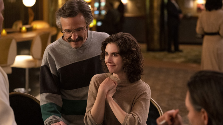 Sam (Marc Maron) looking over Ruth's (Alison Brie) shoulder on GLOW