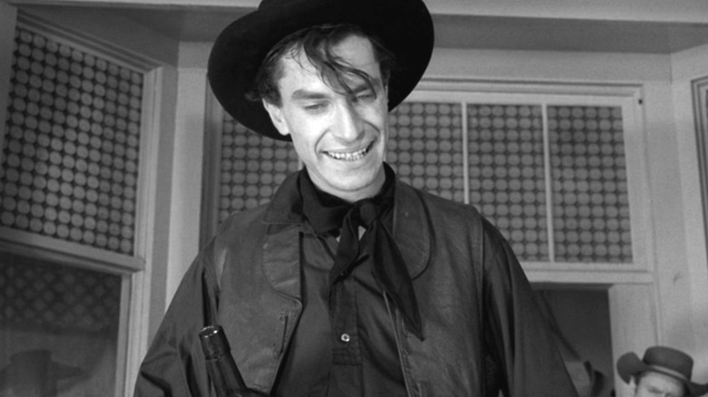 Dan Hotaling (Martin Landau) holding a bottle on The Twilight Zone