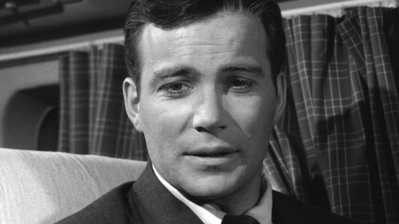 Robert (William Shatner) sitting on a plane on The Twilight Zone