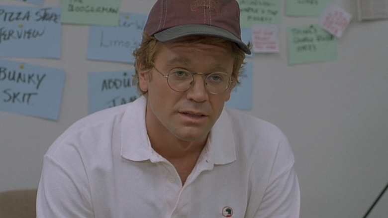 David Letterman (John Michael Higgins) in front of pitch board in The Late Shift