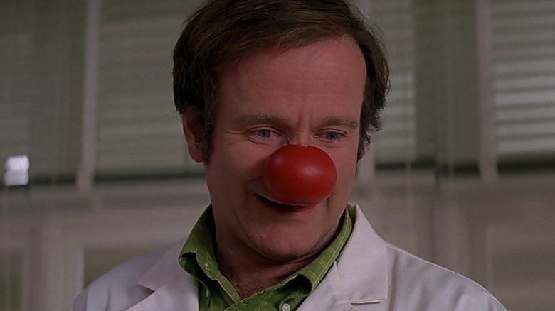Dr. Patch Adams (Robin Williams) wearing a big red nose in Patch Adams