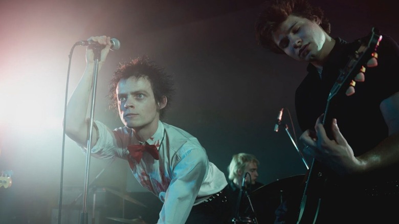 Johnny Rotten (Anson Boon) and Steve Jones (Toby Wallace) performing onstage in Pistol