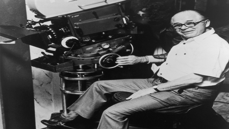 Billy Wilder smiles with Panavision camera on set