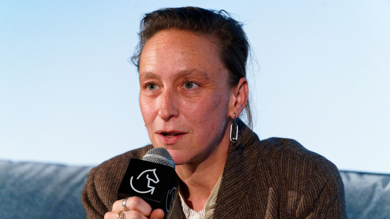 Celina Sciamma talking into microphone