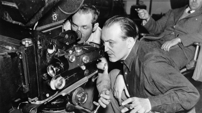 Fritz Lang looking through camera with colleague