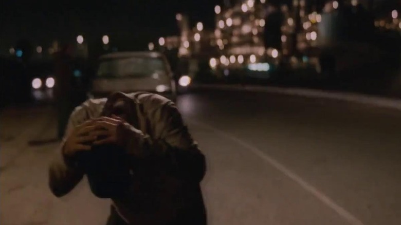 John Malkovich clutching his head in Being John Malkovich