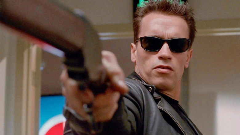 The Terminator (Arnold Schwarzenegger) wielding a gun in The Terminator