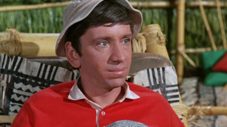 Gilligan (Bob Denver) sitting in a chair on Gilligan's Island