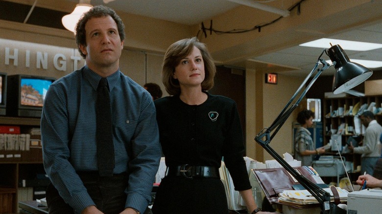 Alber Brooks as Aaron and Holly Hunter as Jane, watching a coworker shine in Broadcast News