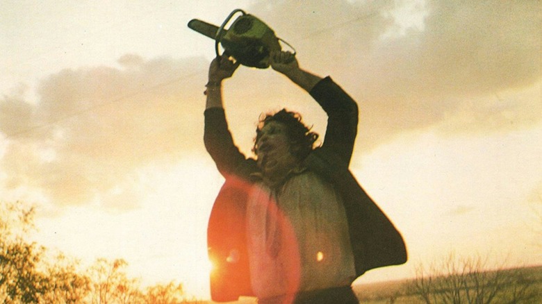 Leatherface swirling his chain saw in The Texas Chain Saw Massacre