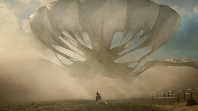 A big, billowing alien named Jean Jacket chases OJ (Daniel Kaluuya) on horseback in Nope