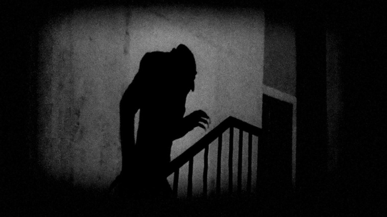 The shadow of Nosferatu creeping up the stairs
