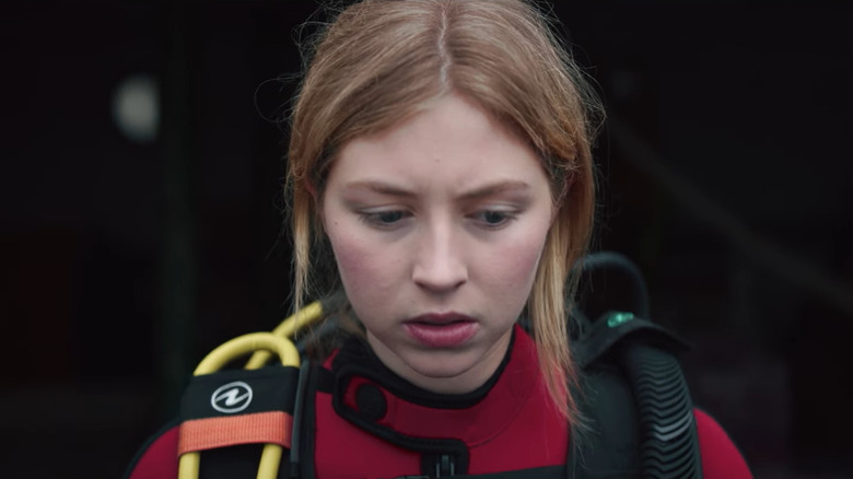 Hermione Corfield as Siobhán wearing scuba suit with red top in Sea Fever