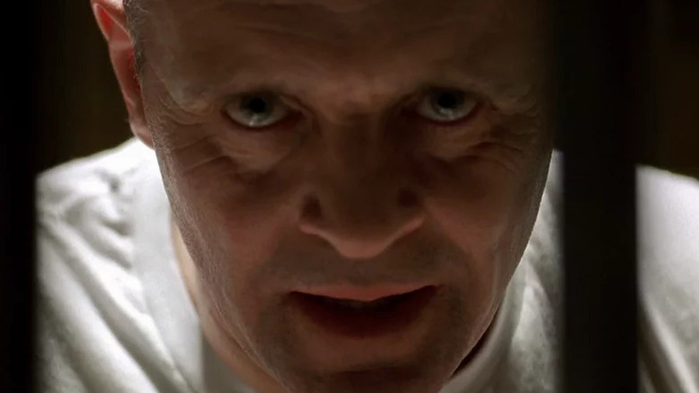 Anthony Hopkins as Hannibal Lecter looking menacingly through the bars in The Silence of the Lambs