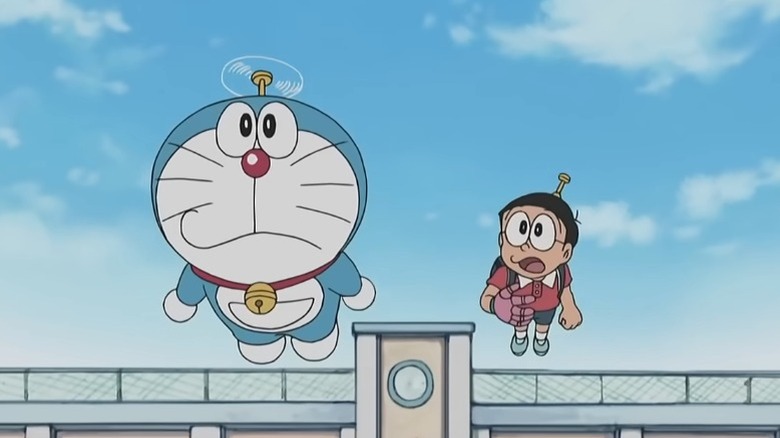 Doraemon and Nobita Nobi flying side by side on Doraemon