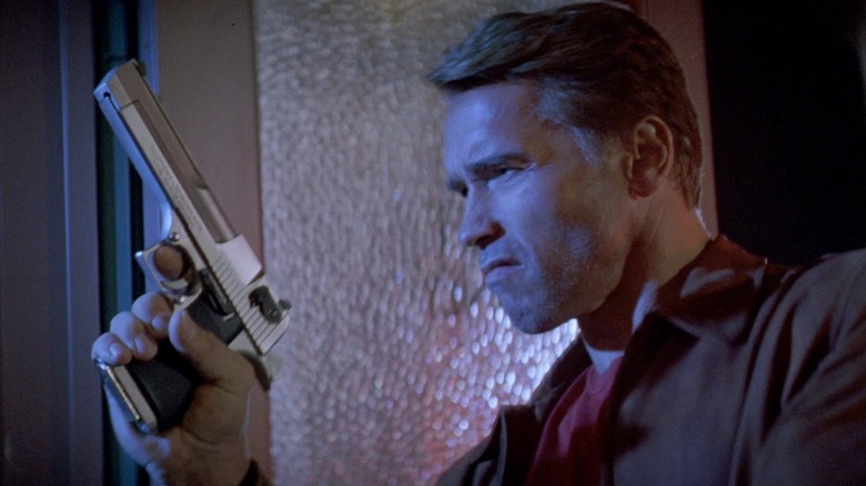 Jack Slater (Arnold Schwarzenegger) holds a big gun in Last Action Hero