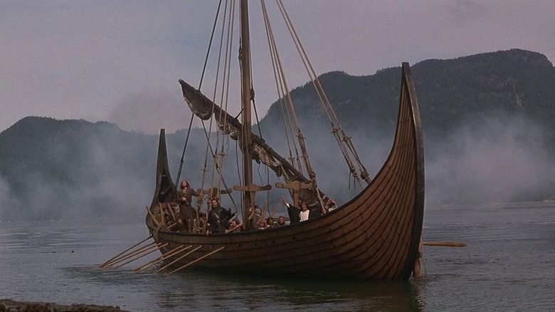 A viking ship pulls into shore in The 13th Warrior