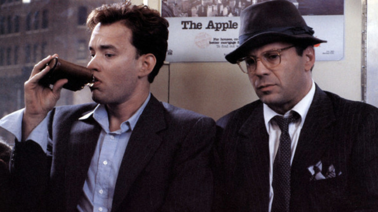 Sherman McCoy (Tom Hanks) and Peter Fallow (Bruce Willis) ride the subway in The Bonfire of the Vanities
