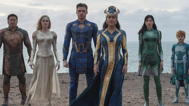 Don Lee as Gilgmesh, Angelina Jolie as Thena, Richard Madden as Ikaris, Salma Hayek as Ajak, Gemma Chan as Sersi, and Lia Mc Hugh as Sprite on the beach in Eternals