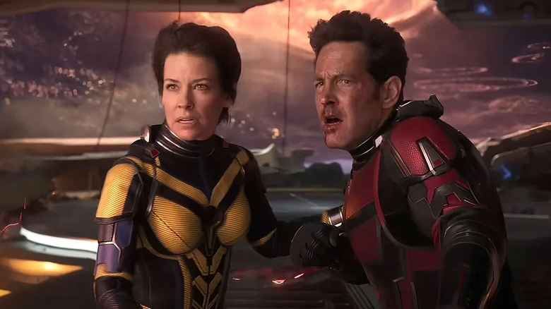 Evangeline Lilly and Paul Rudd as The Wasp and Ant-Man, watching something in fear, in Ant-Man and the Wasp: Quantumania