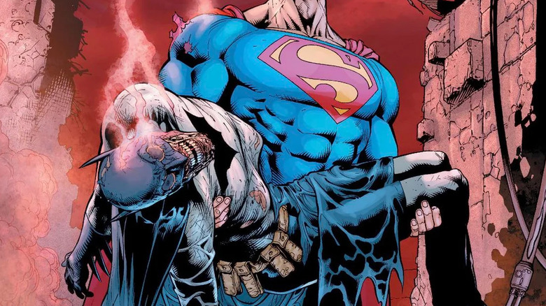 Superman carries Batman's corpse