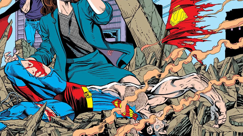Superman's bloody corpse in rubble, surrounding by people